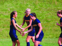 Sam Brown ’20 and Erin Martin ’20 help Girls’ Varsity Soccer win against Greenwich on September 21.