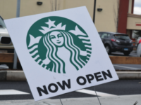 A sign stands in front of the new Starbucks on Route 5, encouraging passersby to check it out.
