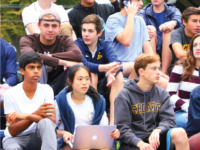 Choate students “cheer on” the football team at a home game.