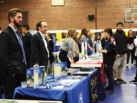 Admissions counselors provide information about their respective schools to students.