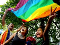 Members of the LGBTQ+ community rejoice on September 6 after the Indian Supreme Court officially decriminalized consensual gay sex. Photo courtesy of NBC News.