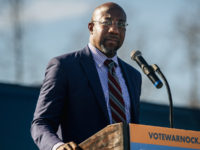 RIVERDALE, GA - JANUARY 04:  Georgia Democratic Senate candidate Rev. Raphael Warnock speaks at a drive-in rally on January 4, 2021 in Riverdale, Georgia. In the lead-up to the January 5 runoff election, Democratic Senate candidate Rev. Raphael Warnock continues to focus on voting efforts across the state of Georgia. (Photo by Brandon Bell/Getty Images)